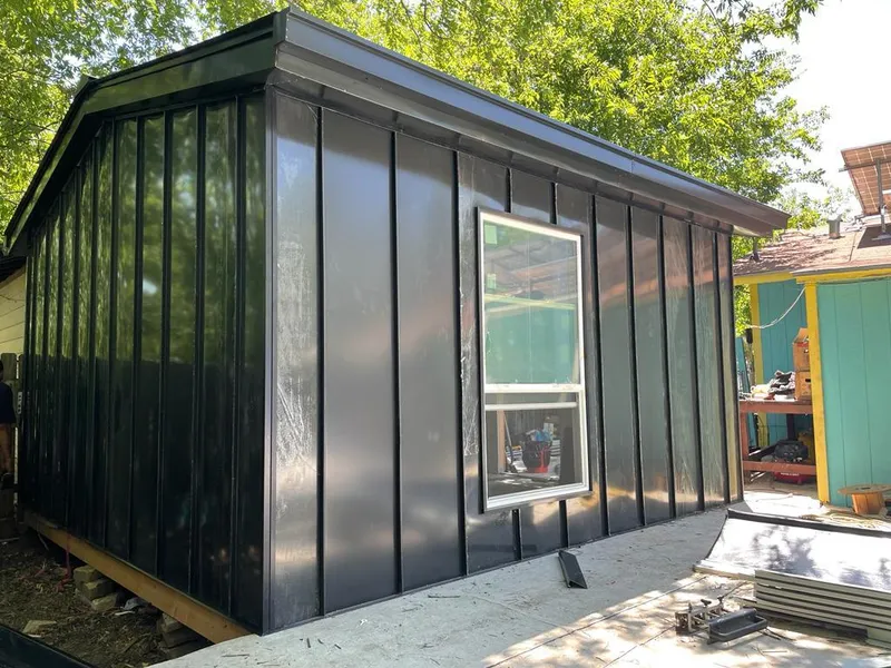 Black standing seam metal wall panels for Roof Inspection in Carrollton