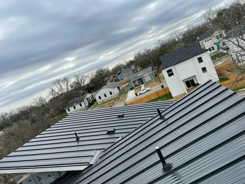 Standing seam metal roof panels with vents for Skylight Repair in Carrollton